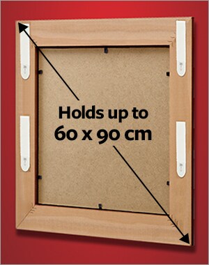 A frame holding a maximum size of 60 x 90 cm using 4 sets of Large picture hanging strips.