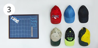 Hat hanging on wall with Command™ Clear Medium Hooks
