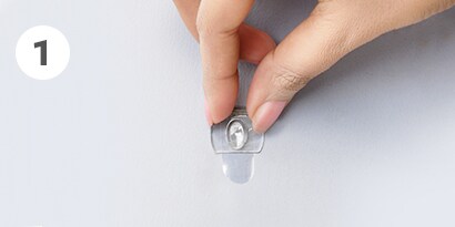 how to remove clear command hooks step 1- hold hook gently in place
