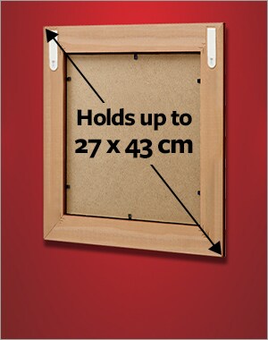 A frame holding a maximum size of 27 x 43 cm using 2 sets of medium or narrow picture hanging strips.