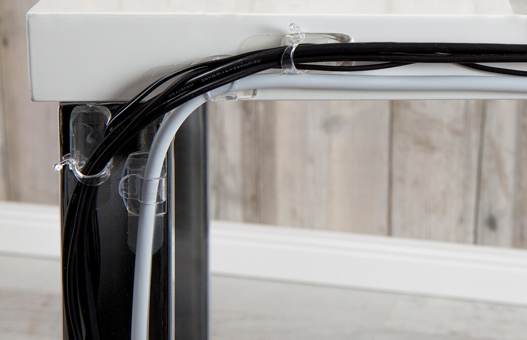 image of well-organised cords on the table with the help of command cord clips, organisers, and bundlers