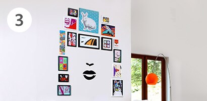 Unique photo wall featuring a face wall decal
