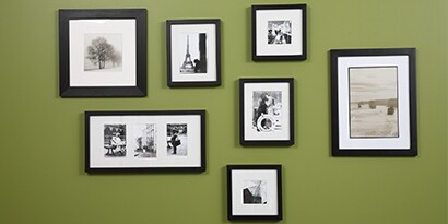 hanging pictures on a wall with picture hanging strips
