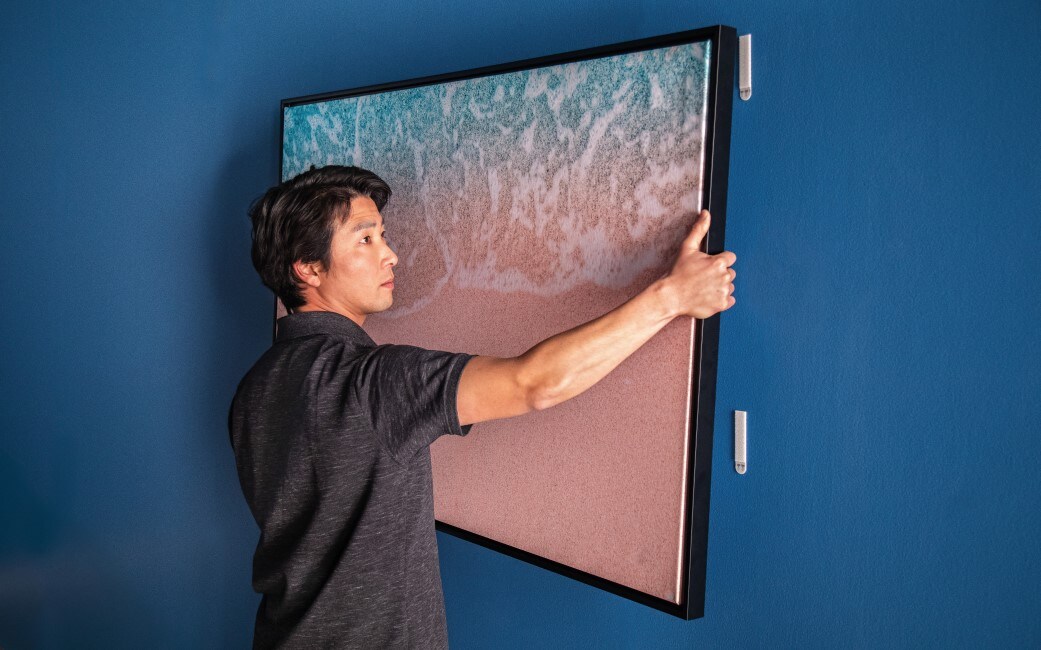 use command picture hanging strips to decorate your walls