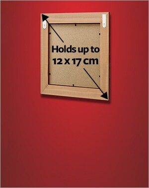 A frame holding a maximum size of 12 x 17 cm using 2 sets of small picture hanging strips.
