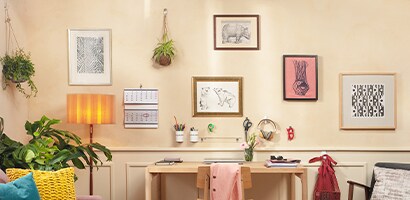picture frames and artworks displayed using command wall hanging hooks
