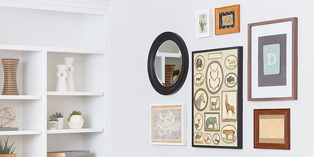 mirror and artworks displayed with command picture hanging strips