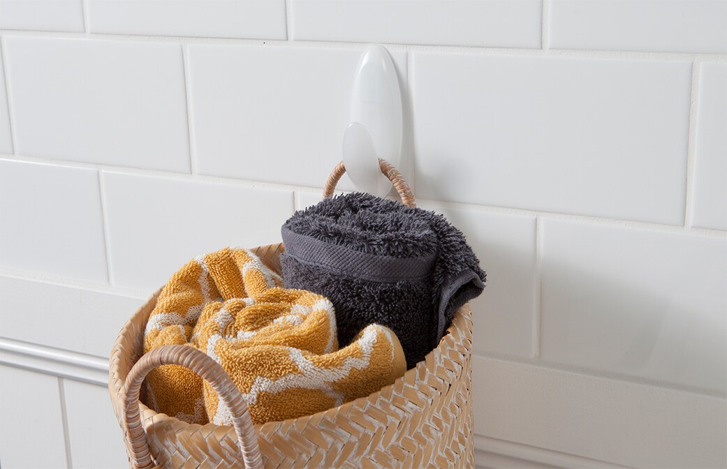 image of a command wall hanger hook in the wet & dry range used to hang towels in a basket