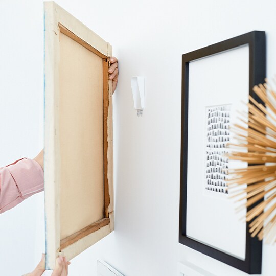 hanging a frame using Command™ Picture Hanging Strips