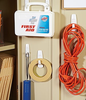 Select convenient locations for the Command™ Hooks such as inside a storage cabinet and on the wall next to a printer
