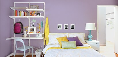 Bedroom featuring backpack wall hangers and wall hooks for school bags
