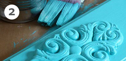 Painted board as a kitchen hand towel rack
