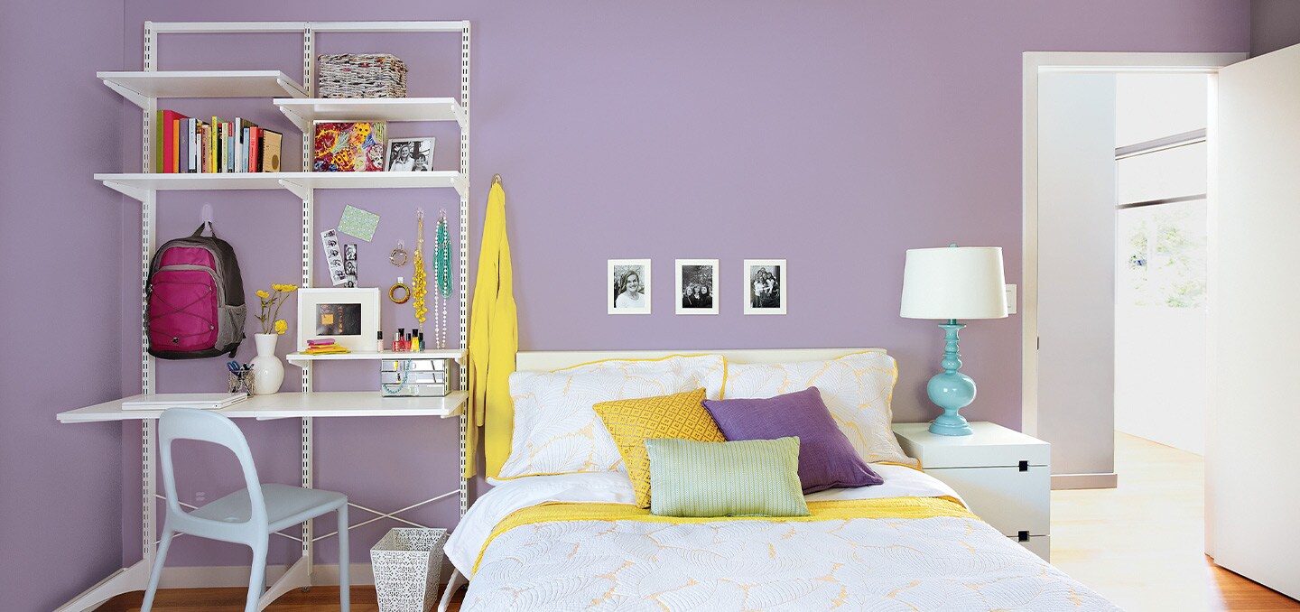 Bedroom featuring backpack wall hangers and wall hooks for school bags
